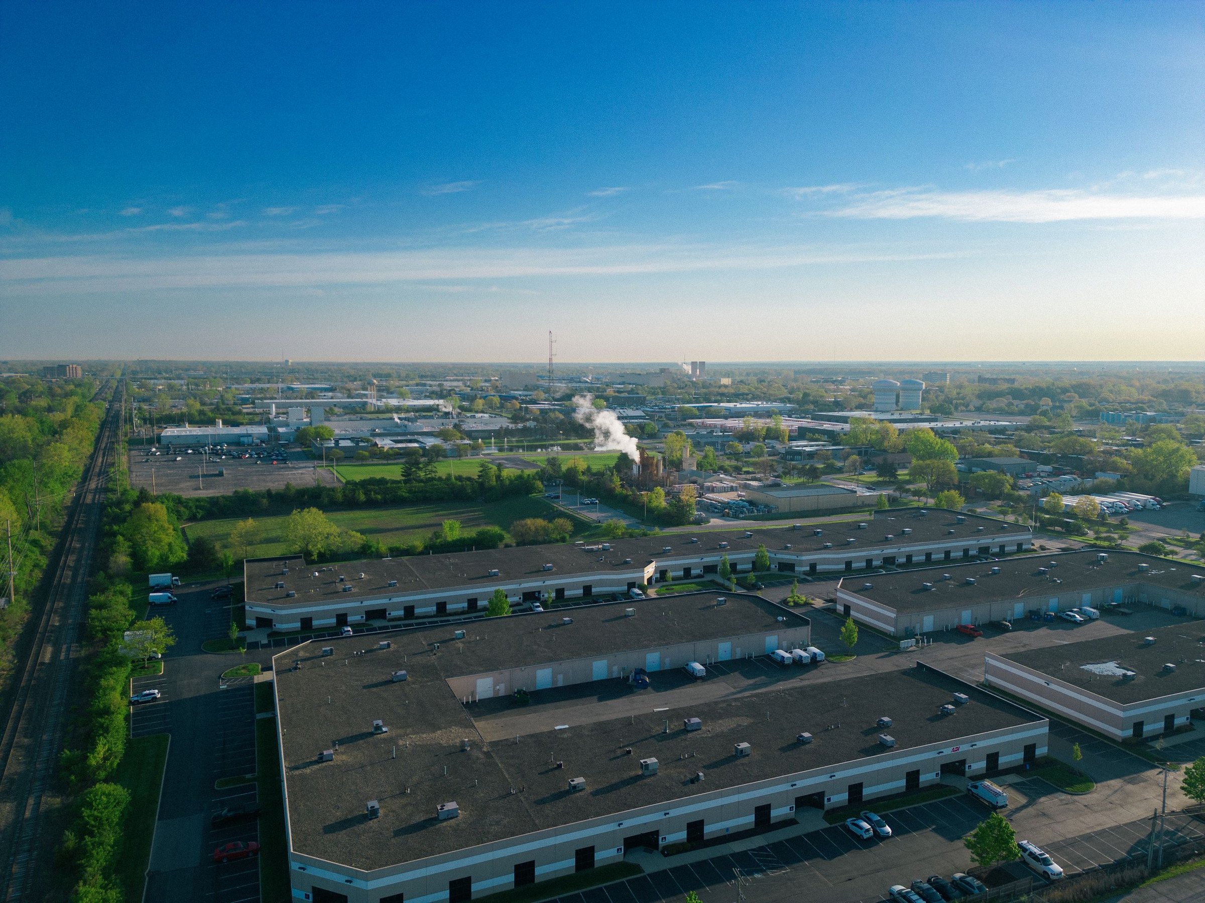Aerial view of a low-rise flex industrial park with drive-in bays and parking